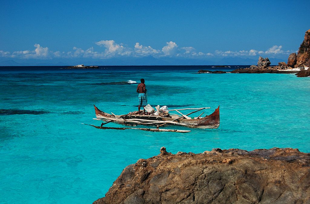 Fisherman in the turquoise sea